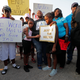Kiwanda Robinson (center), mother of Keeven Robinson, holds family friends Madysen Johnson (right) and Madysen’s sister Morgan Johnson at the start of a solidarity march for Keeven in Jefferson Parish, La., on May 14, 2018.